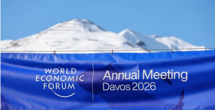 Banner for the World Economic Forum Annual Meeting Davos 2026 against a snowy mountain backdrop.